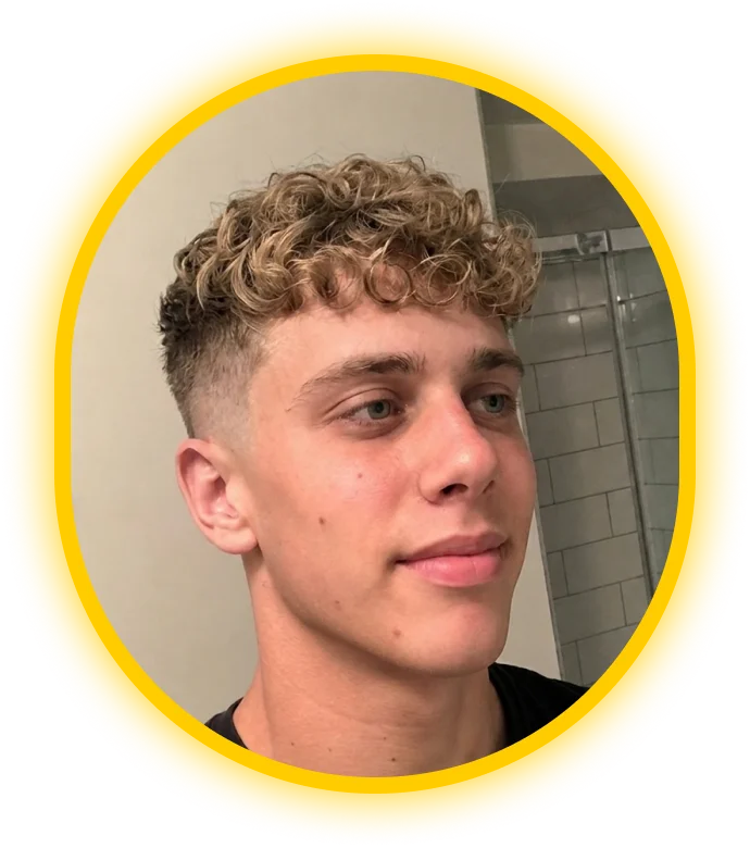 Glancely AI recommendation rendered on the user's photo: a short, textured curly fade.